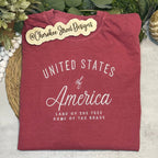 Maroon t-shirt with 'United States of America' text on a light background