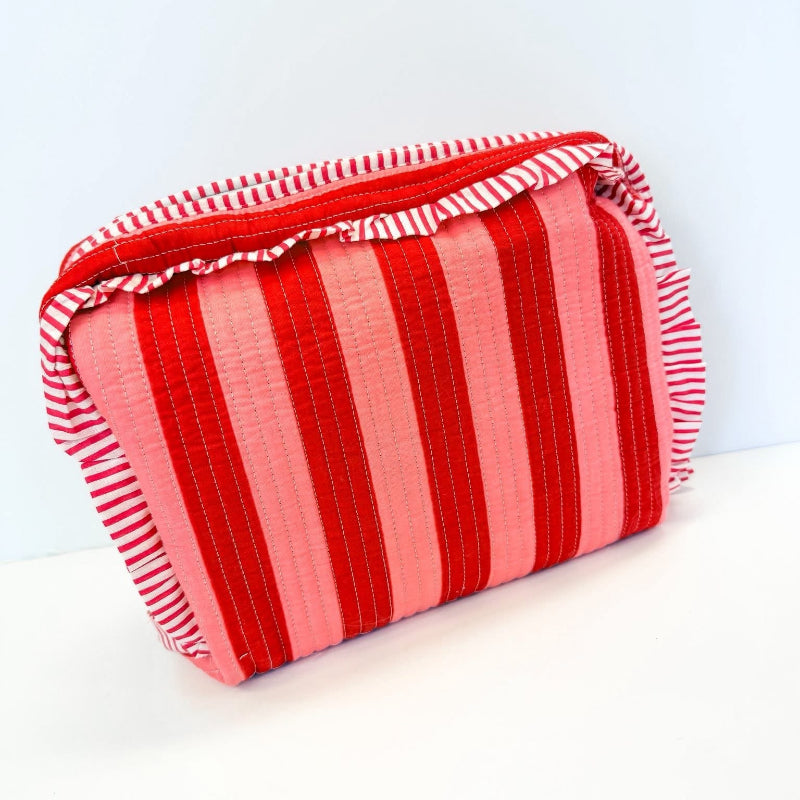 Red and pink striped pouch on a white background