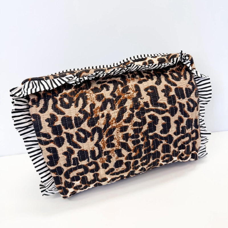 Clutch bag with leopard print pattern on a white background