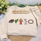 Beige sweatshirt with embroidered designs and 'Cherokee Street Designs' label on a neutral background.