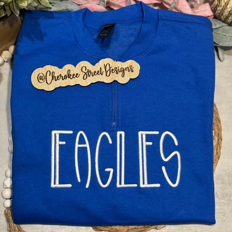 Blue sweatshirt with 'EAGLES' text 