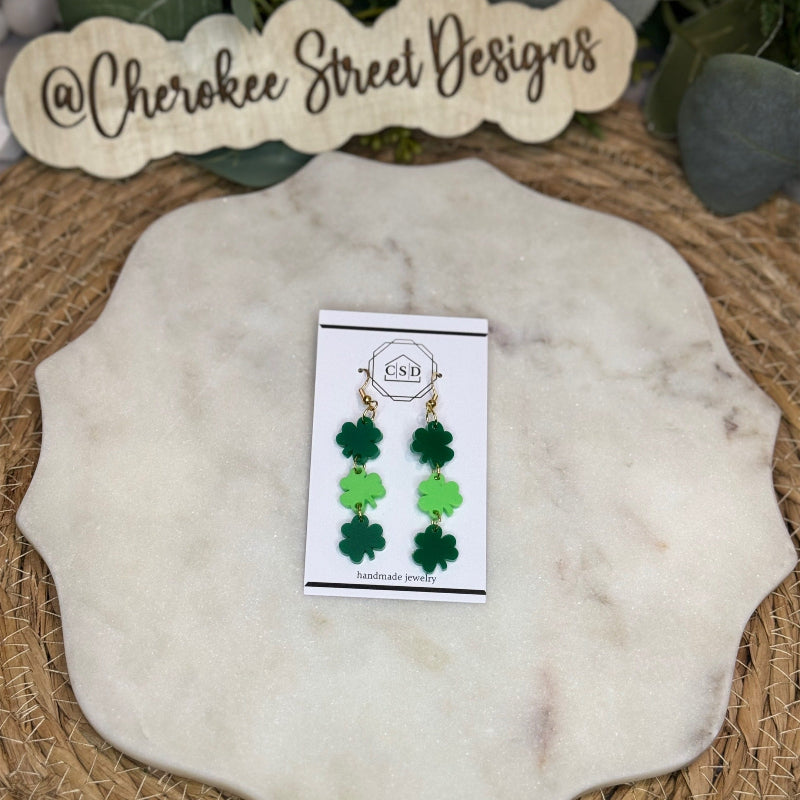 Green shamrock earrings on a card 