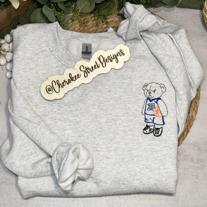 Gray sweatshirt with a teddy bear design 