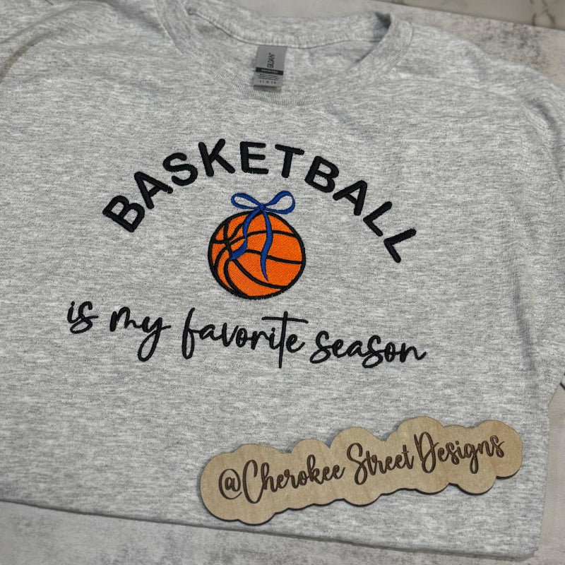 Gray sweatshirt with 'Basketball is my favorite season' text and basketball graphic