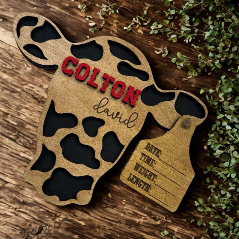 Wooden baby birth announcement plaque with cow print design 