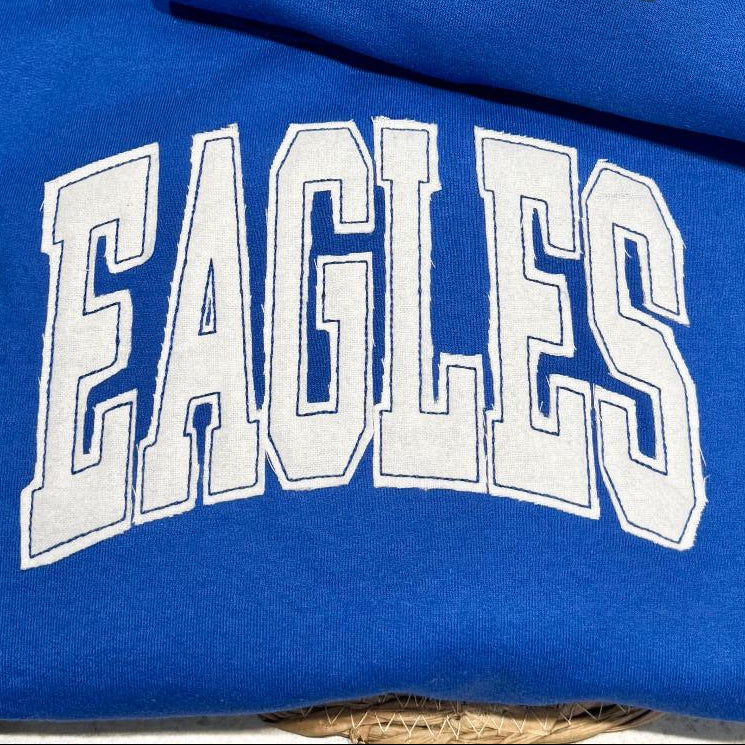 Blue sweatshirt with 'EAGLES'