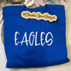 Blue sweatshirt with 'EAGLES' text 