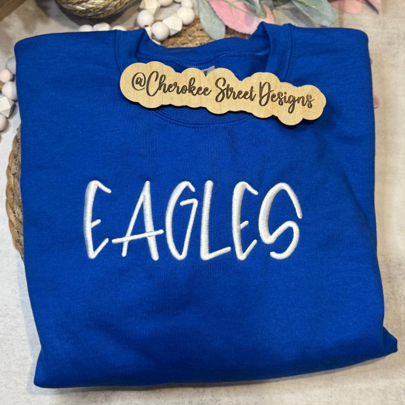 Blue sweatshirt with 'EAGLES' text 