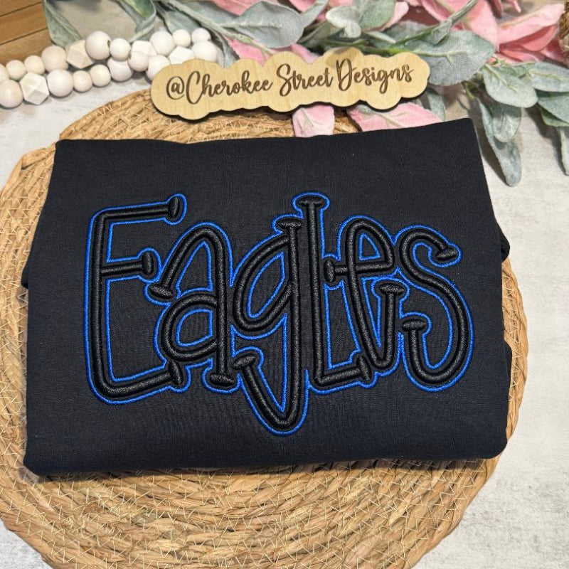 Black sweatshirt with 'EAGLES' embroidered in blue 