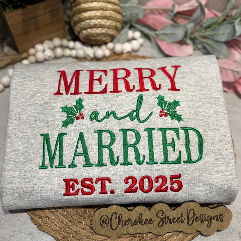 sweatshirt with 'Merry and Married Est. 2025' text 