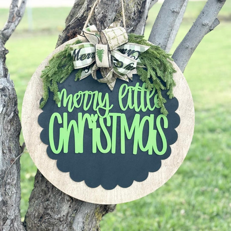Decorative sign with 'Merry Little Christmas' text 