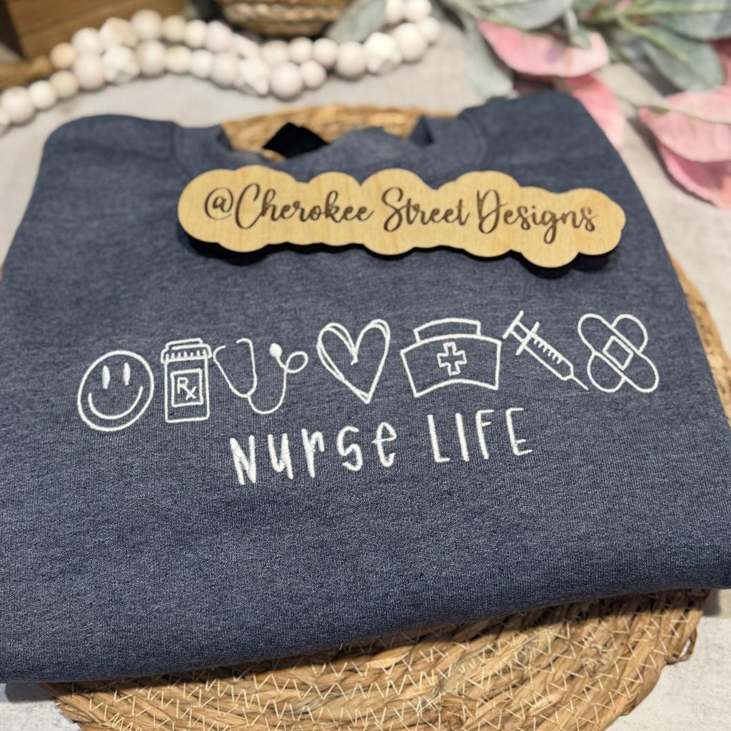 Navy blue sweatshirt with 'Nurse Life' design 
