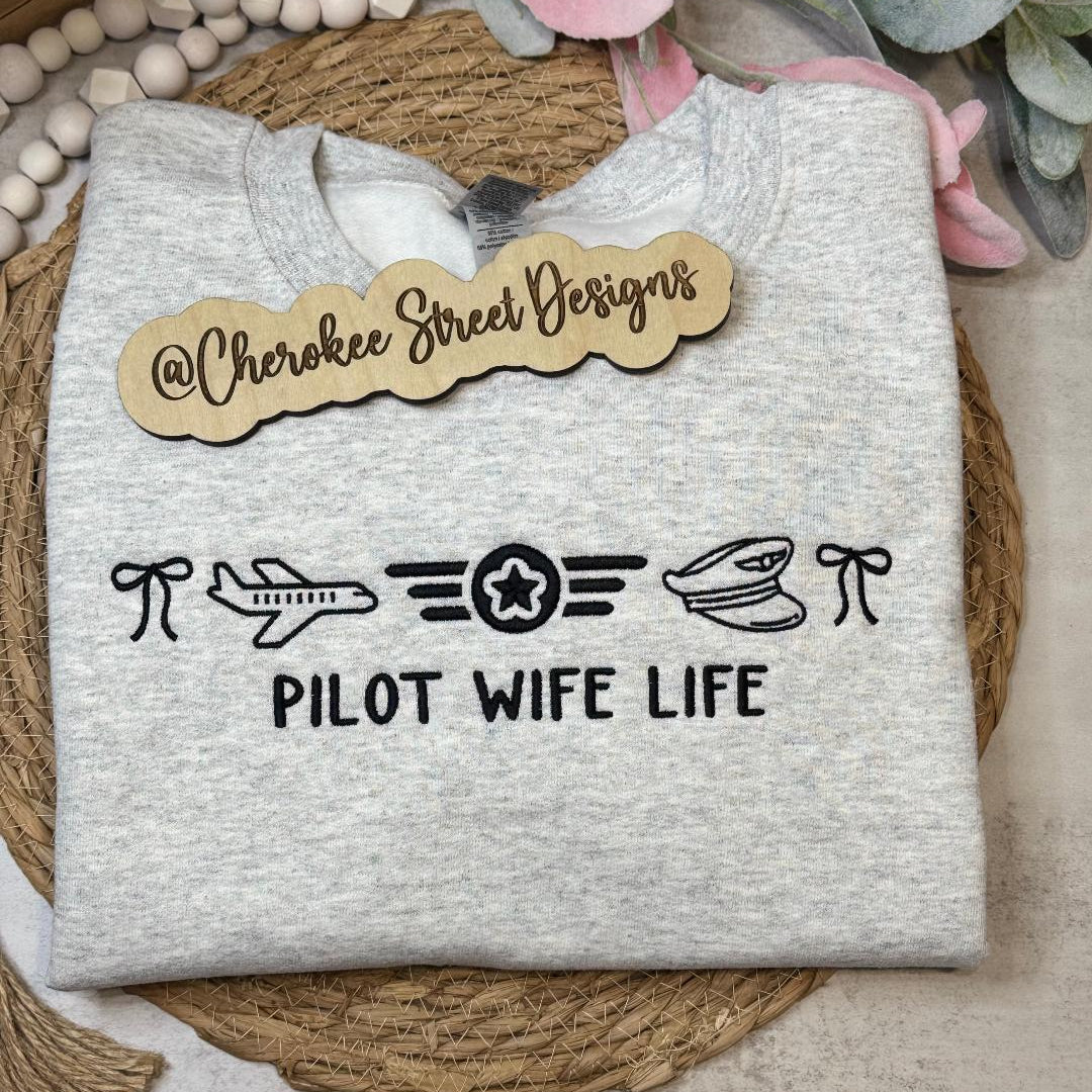  gray sweatshirt with 'Pilot Wife Life' text and symbols