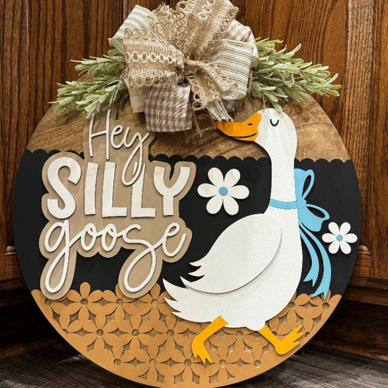 Decorative sign with a goose illustration and text 'Hey Silly Goose' 