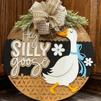 Decorative sign with a goose illustration and text 'Hey Silly Goose' 