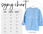 Blue sweatshirt on a hanger with a sizing chart on the left side.