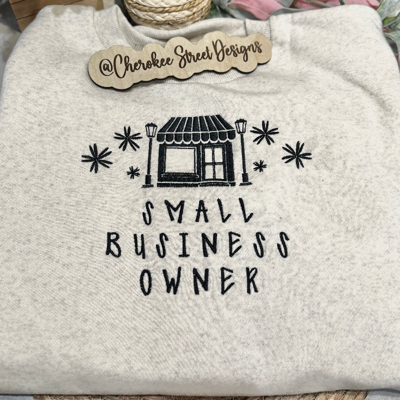 Gray sweatshirt with 'Small Business Owner' text 