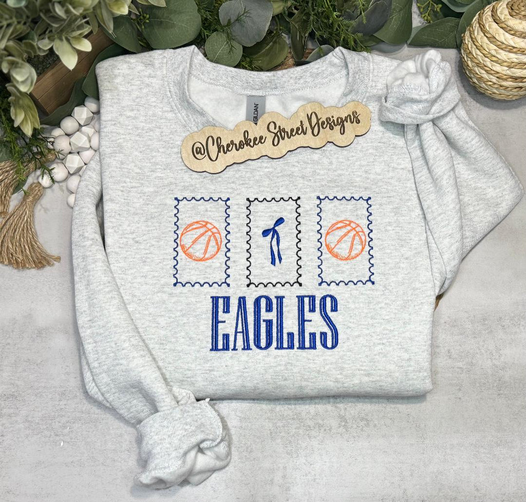 Gray sweatshirt with sports-themed design and 'EAGLES' text,