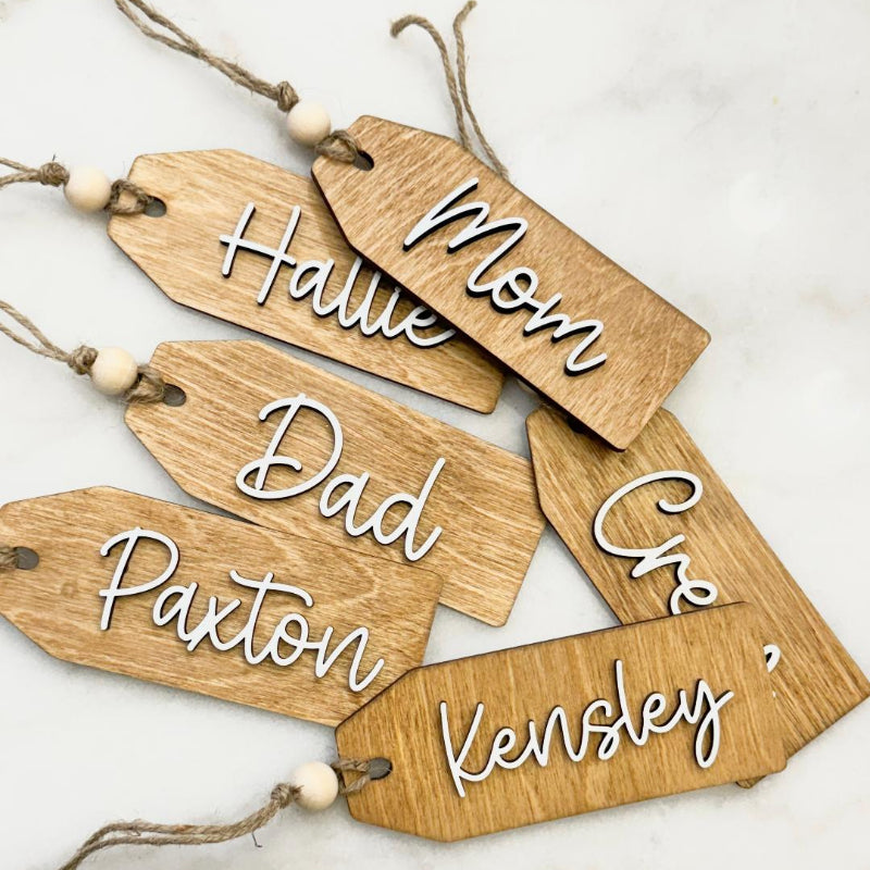 Wooden name tags with layered names 