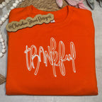  orange sweatshirt with 'thankful' text 