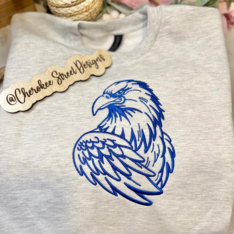 Gray sweatshirt with blue eagle design 