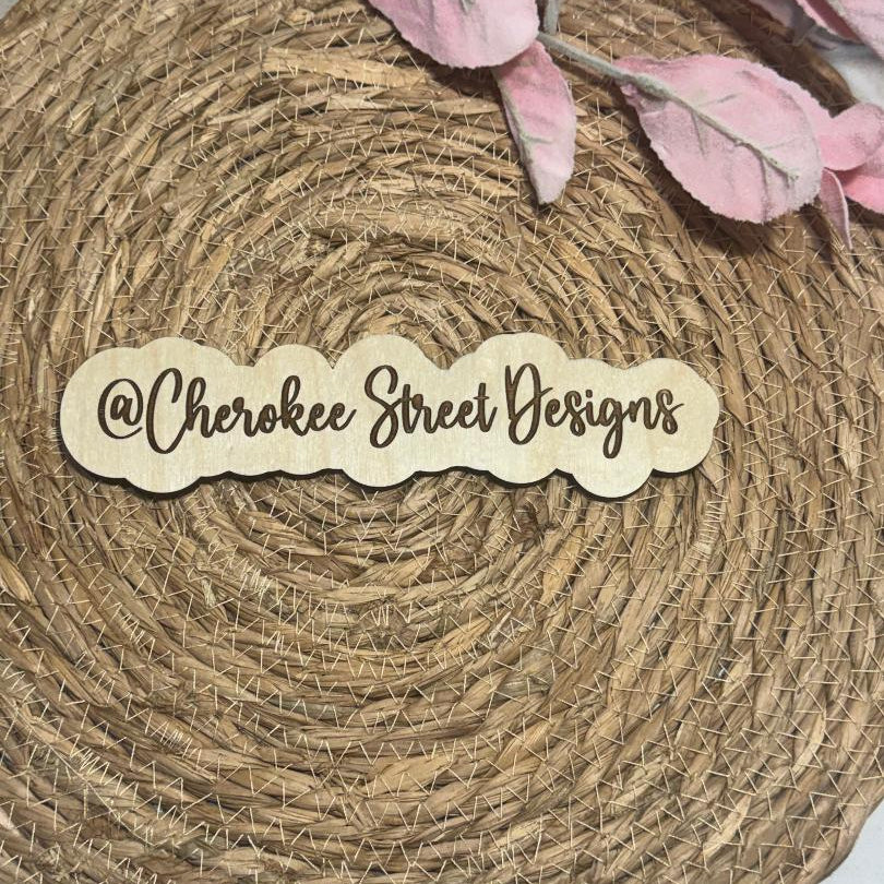 Wooden sign with 'Cherokee Street Designs' 