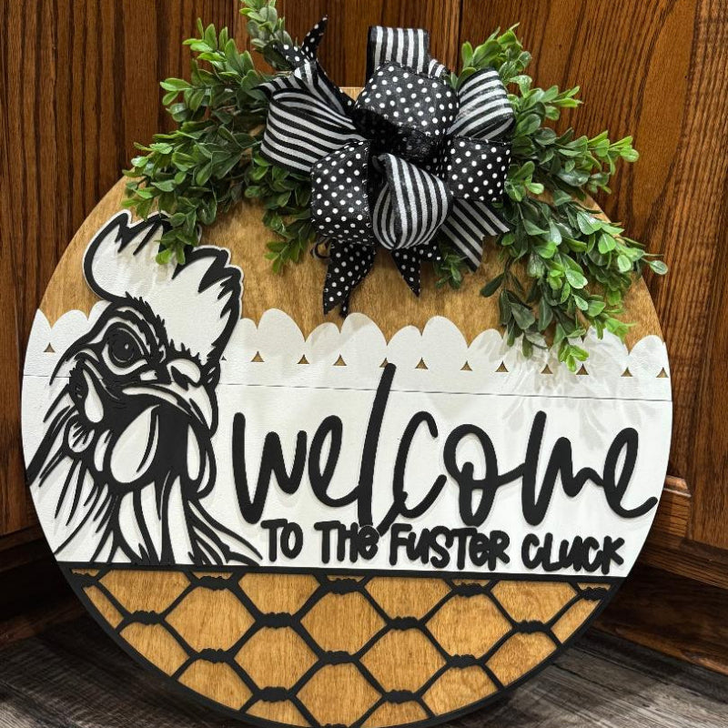 Decorative door sign with rooster design and 'Welcome to the Foster Clock'